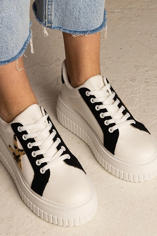 Bielo-čierne tenisky zdobené...