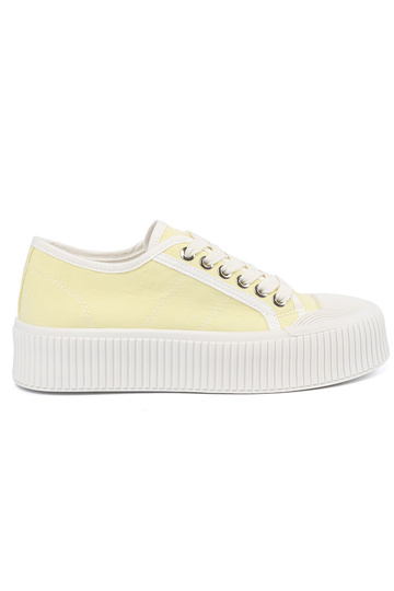 Žlté topánky so šnúrkami na...