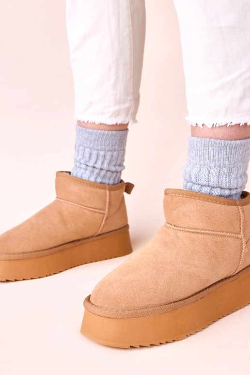 Hnedé snehové čižmy z pravej...