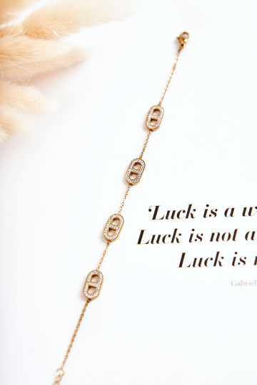 Dámsky náramok s trblietavými očkami zlatej farby