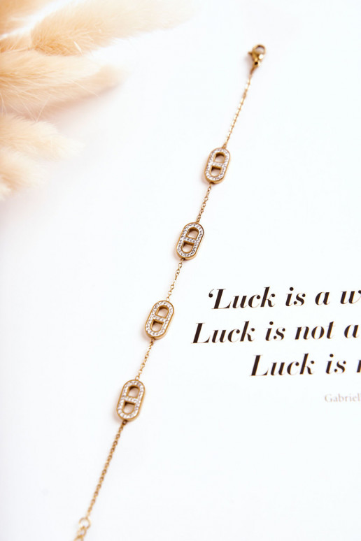 Dámsky náramok s trblietavými očkami zlatej farby