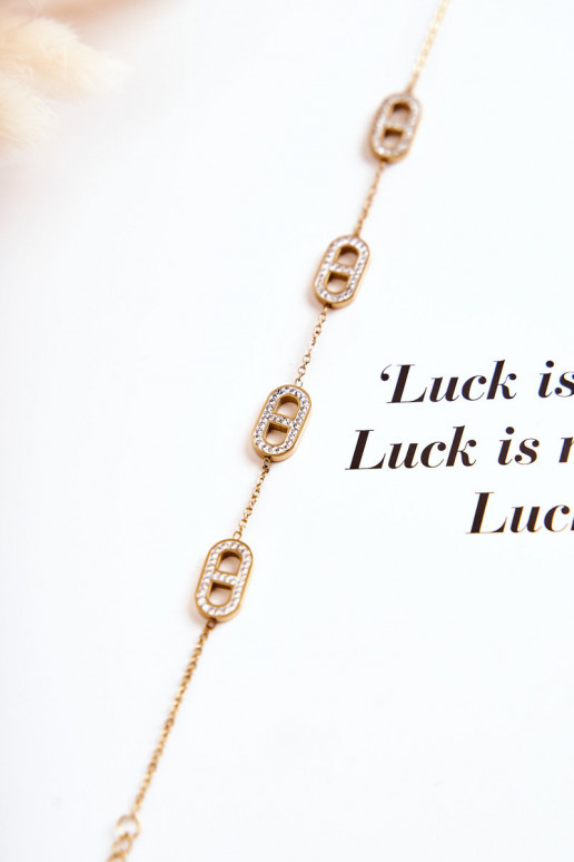 Dámsky náramok s trblietavými očkami zlatej farby