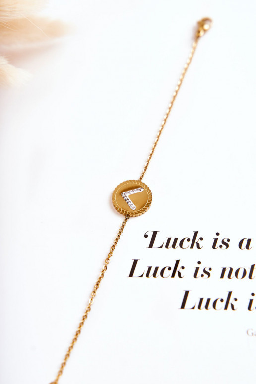 Dámsky náramok s ornamentami a zirkónovými očkami v zlatej farbe Dámsky náramok s ornamentami a zirkónovými očkami v zlatej farbe