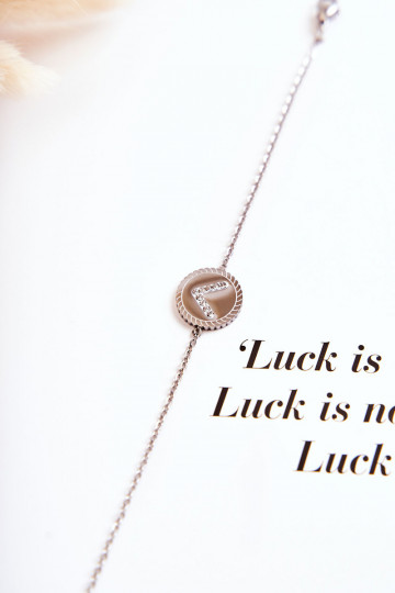 Dámsky náramok s ornamentami a zirkónovými očkami striebornej farby